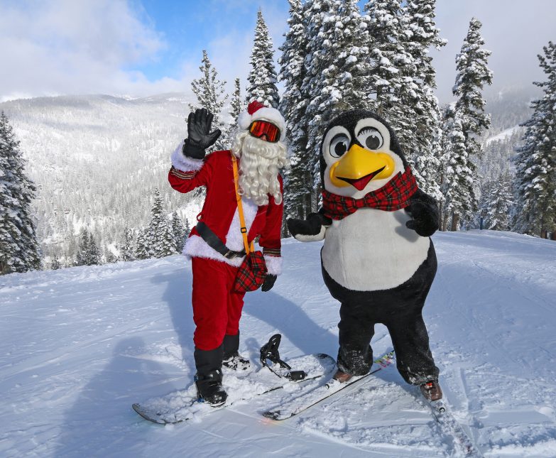 santa and penguin pete on the slopes at diamond peak