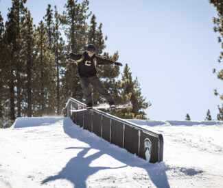 snowboarder on rail